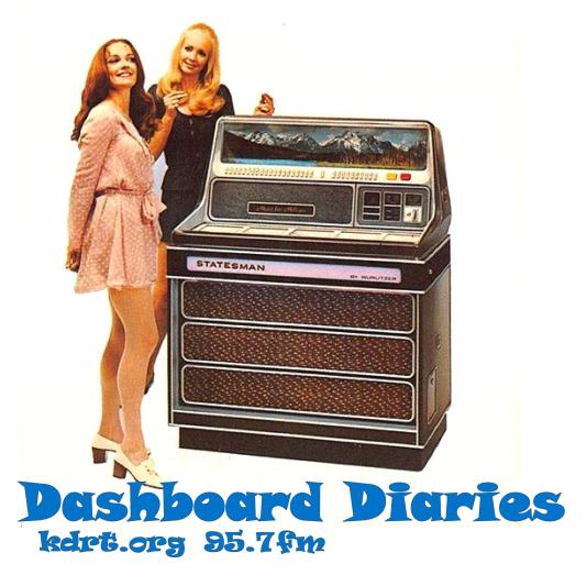 Promotional photo of a 1970 Wurlitzer Statesman jukebox with girls in miniskirts