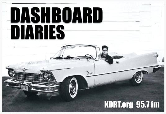 Elvis Presley at the wheel of a vintage Chrysler Imperial convertible