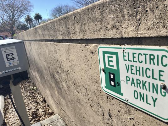 Electric car sign near Davis train station