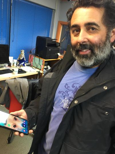 Louie Toro and his phone, at KDRT in Davis, January 2024