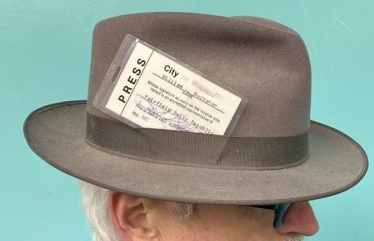 Press pass tuck into fedora
