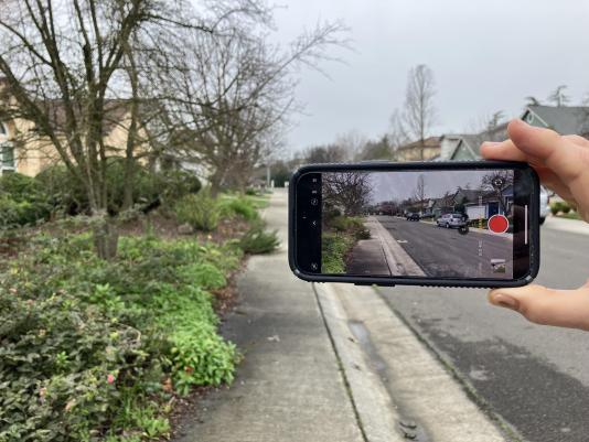 A street in Davis, as seen on a phone camera screen
