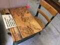 Monticello school desk signed by students and teachers