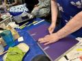 Repairing a book at the Davis Book Menders, July 8, 2025