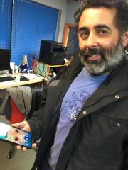 Louie Toro and his phone, at KDRT in Davis, January 2024